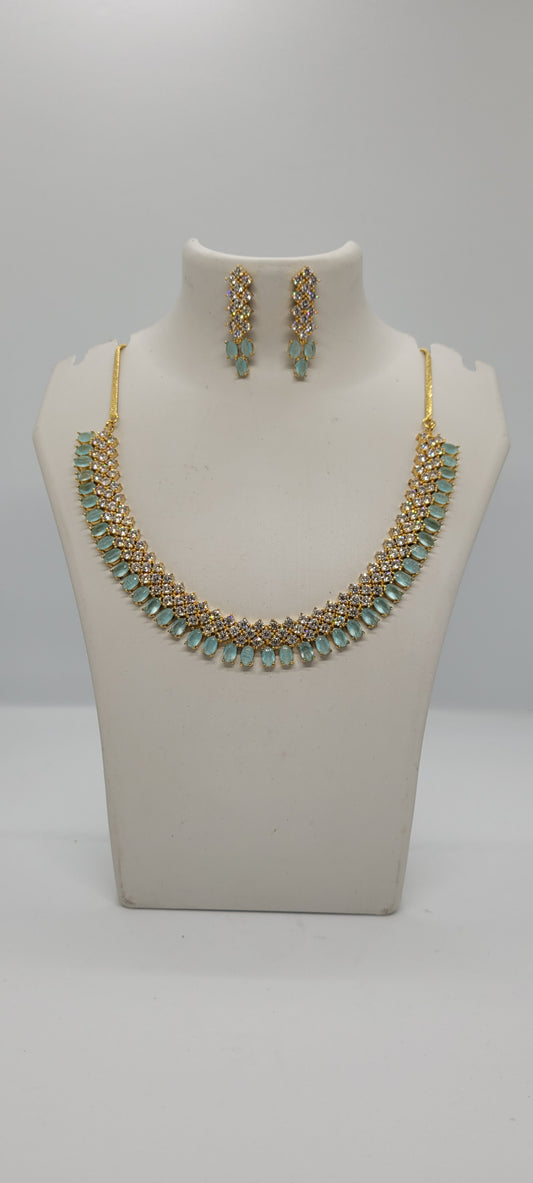 Golden Necklace Set with Light Teal Blue and White American Diamond Stones & Earrings1
