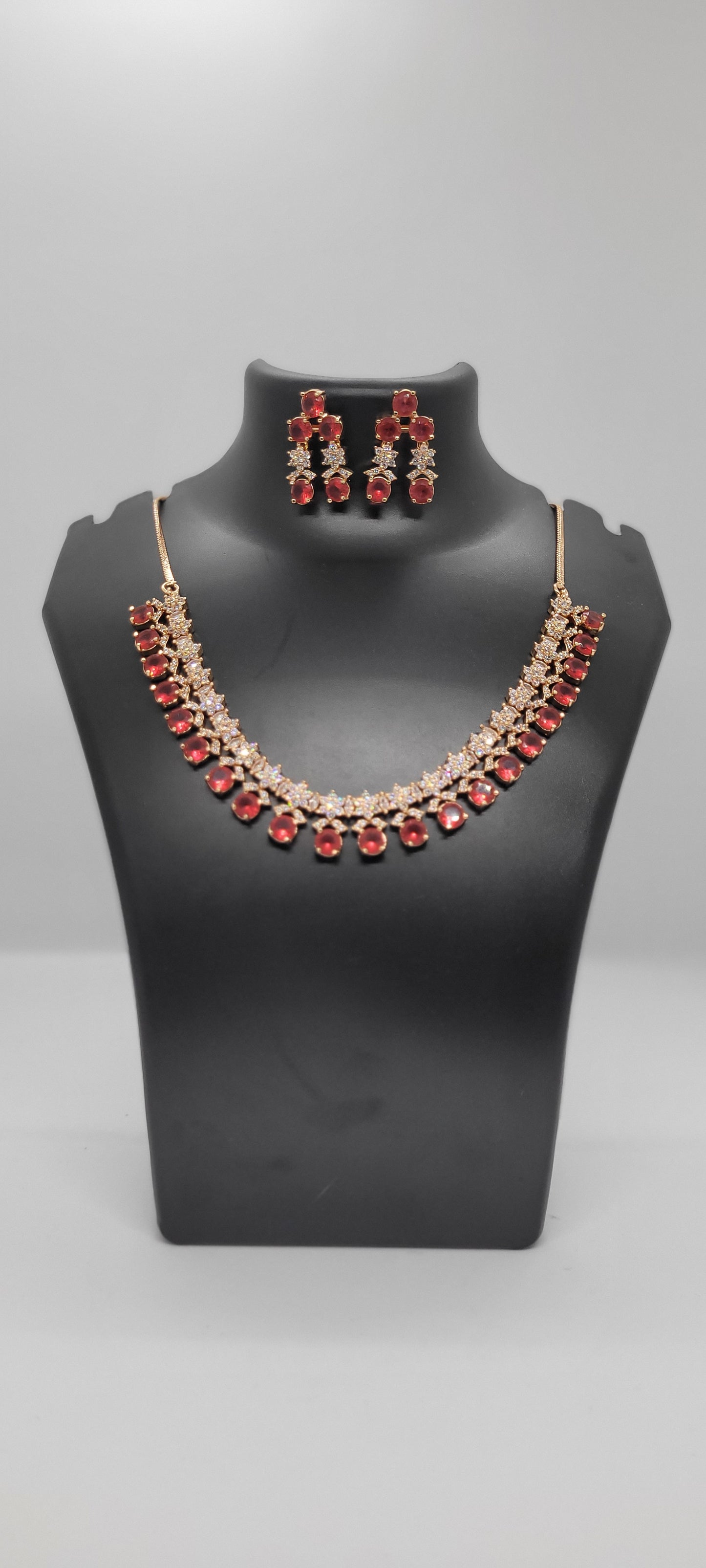 Golden Necklace Set with Light Red and White American Diamond Stones & Earrings