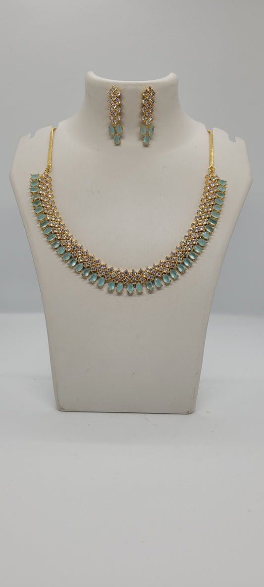 Golden Necklace Set with Light Teal Blue and White American Diamond Stones & Earrings1